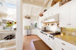 Gather around home cooked meals in this gorgeous kitchen